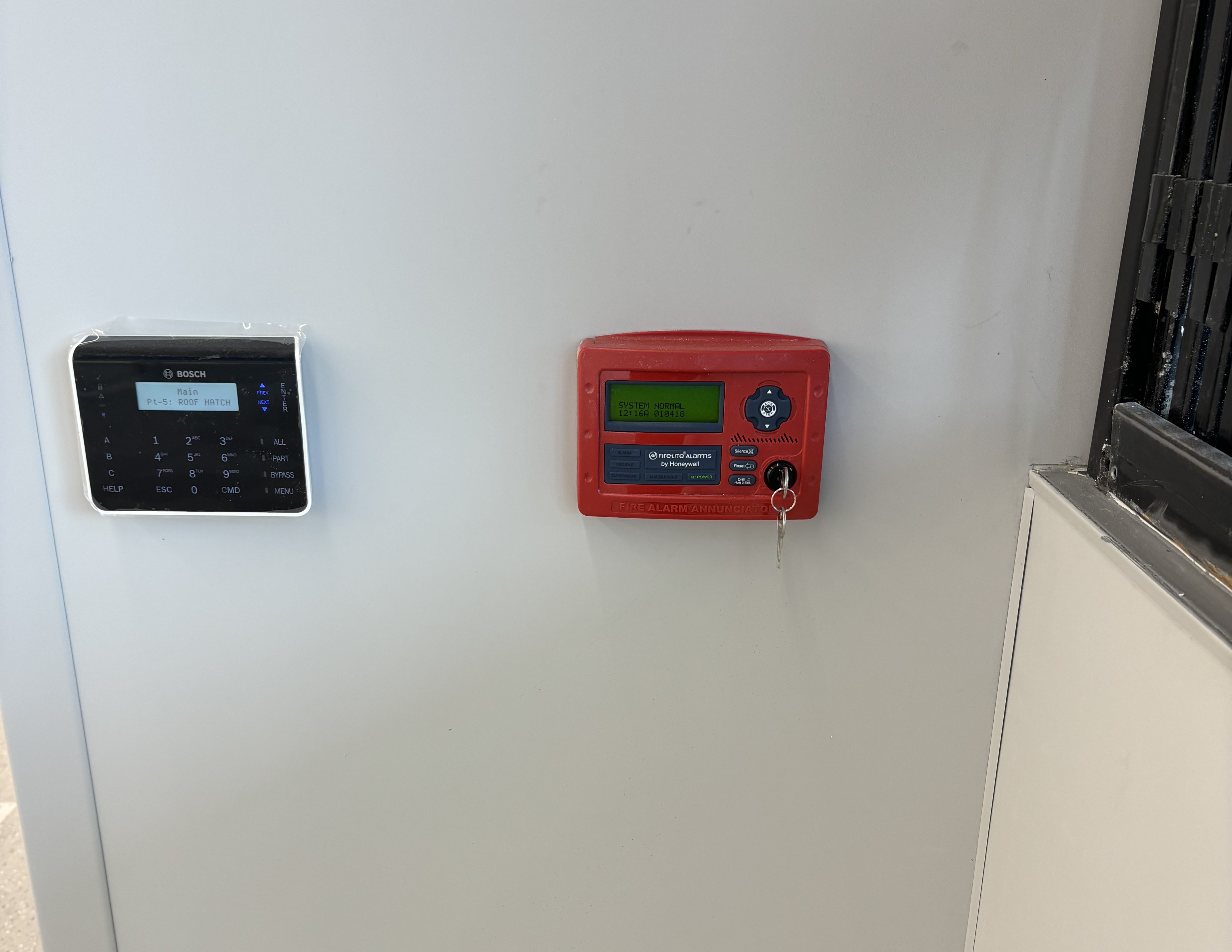 Engineers installing fire sprinkler in office at building site